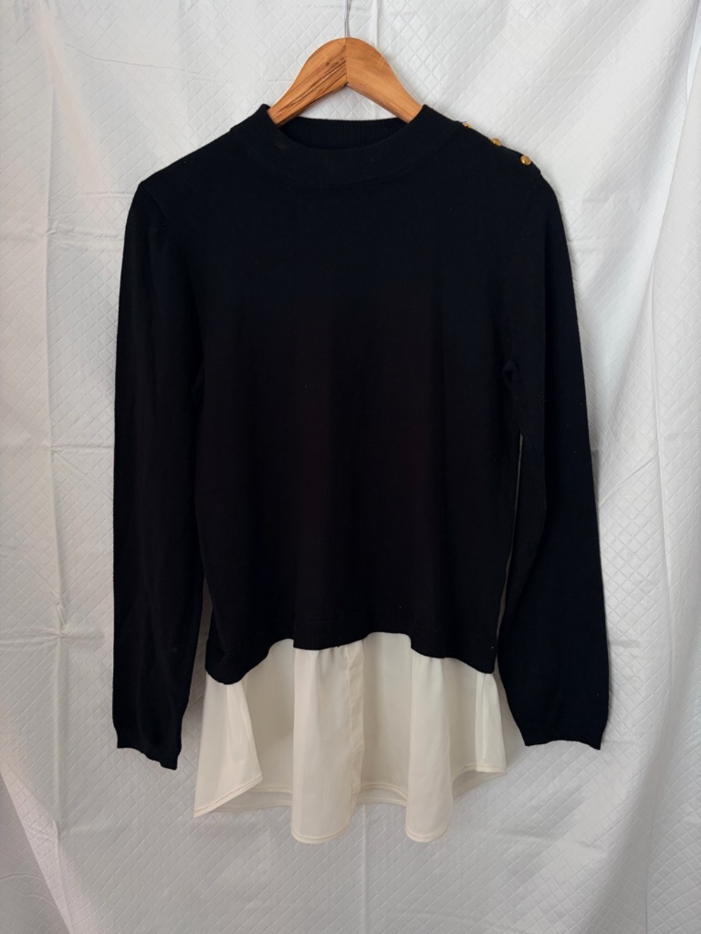 Cielo Black Pullover Sweater with Cream Layered Hem and Gold Shoulder Buttons